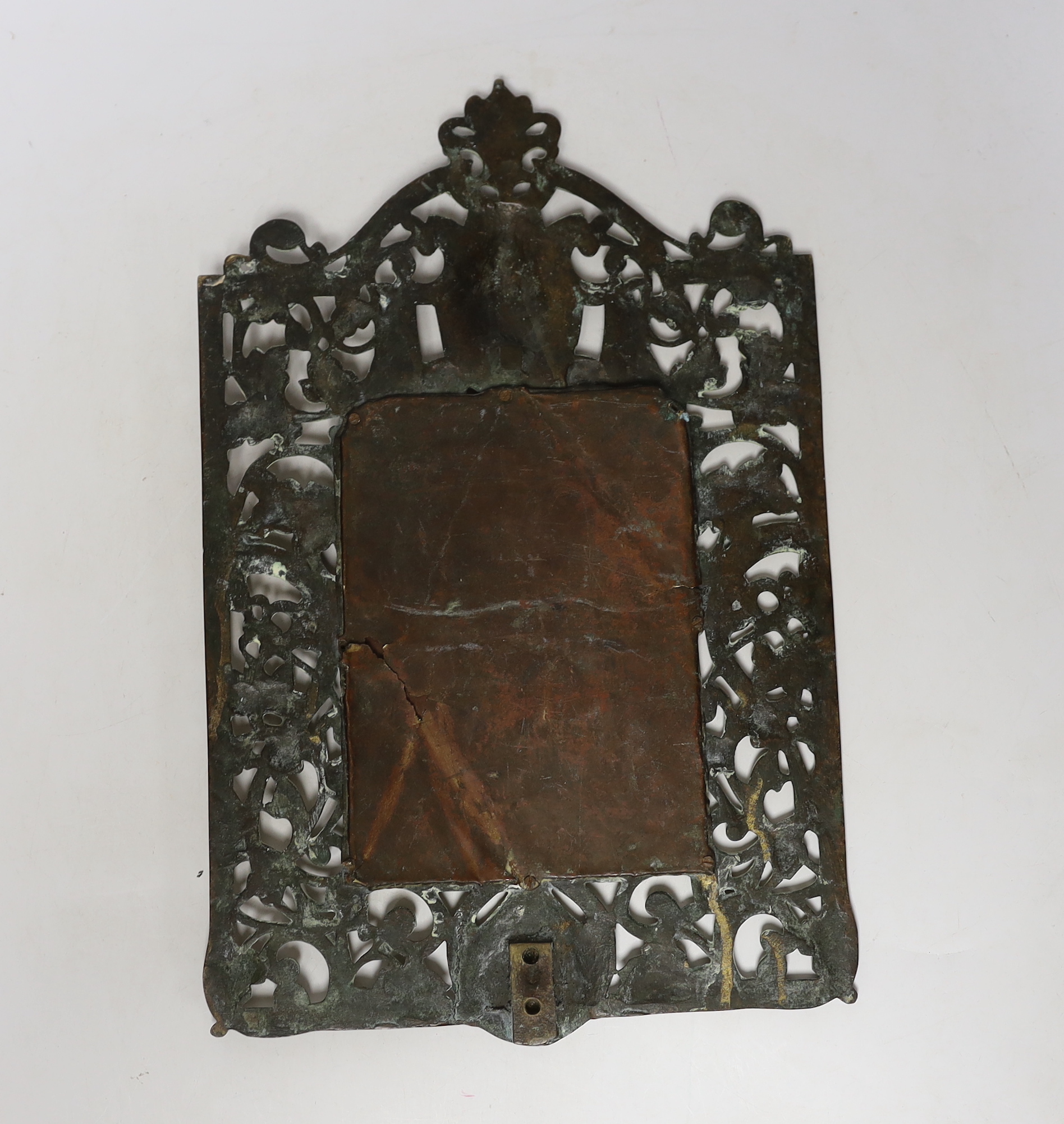 A brass framed mirror, 39cm high